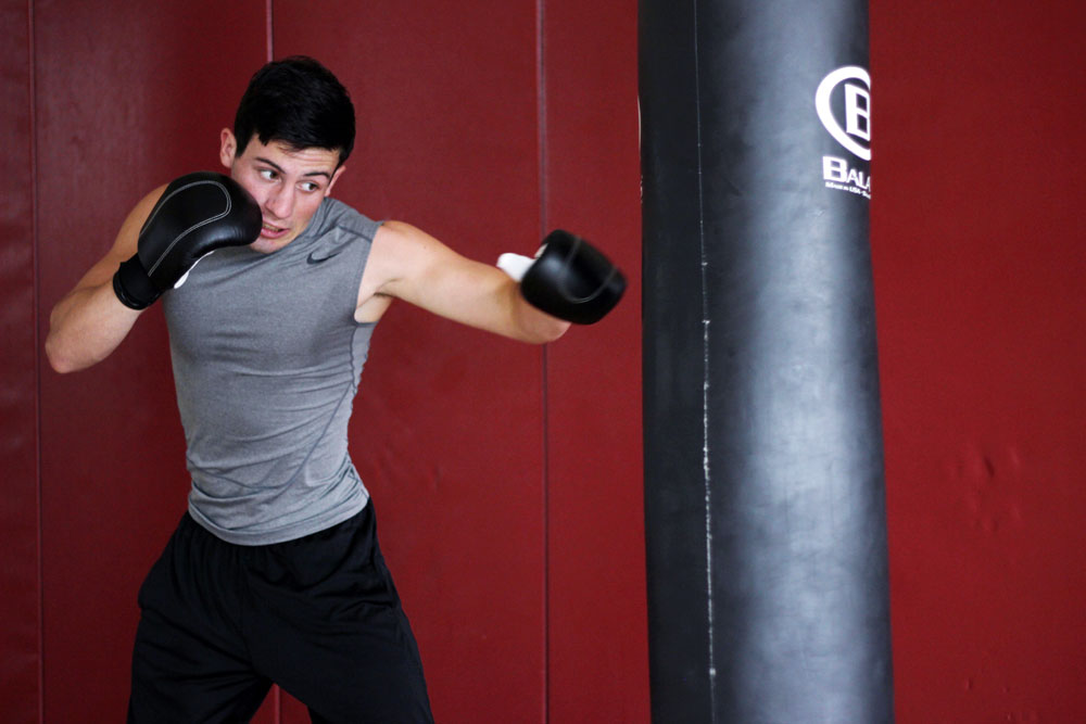 student punching bag